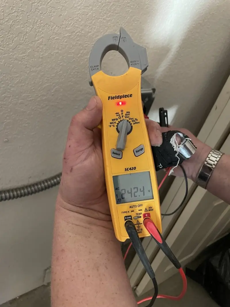 Voltage testing with clamp meter during Electrical Installation Services in Irondequoit
